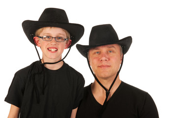 man and child with cowboy hats