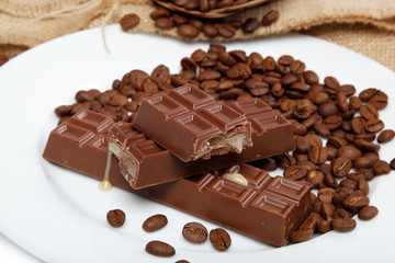 Chocolate and coffee beans on sacking.
