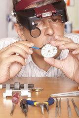 Watch repair craftsman repairing watch