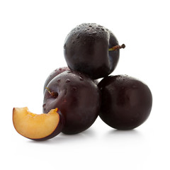 Black plums isolated with clipping path on white background