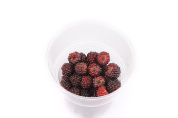 Sweet fresh raspberry fruit with green leaf