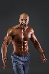 Portrait of muscular screaming men