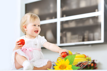 Adorable little girl on a kitchen