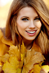 young brunette woman portrait in autumn color