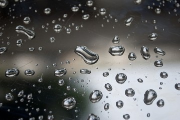 water drops on shiny metal surface