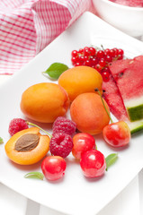 Summer fruits, watermelon, raspberries, cherries and apricots