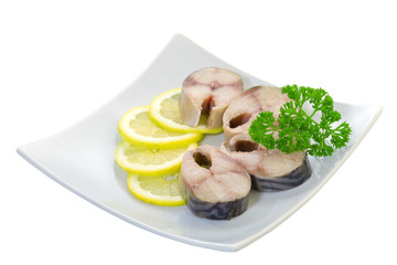 Salted mackerel with lemon on a white background