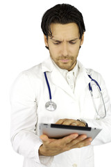 Doctor working with tablet very serious