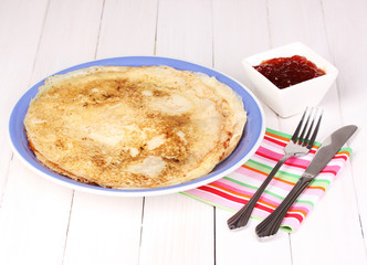 Stack of tasty pancakes on wooden background