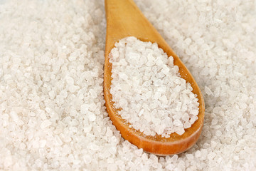 Sea salt with wooden spoon close-up