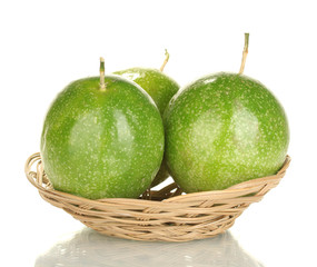 three green passion fruit isolated on white