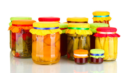 Jars with canned fruits and vegetables isolated on white