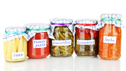Jars with canned vegetables isolated on white