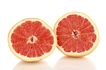 Naklejka na ściany i meble Two halves of ripe grapefruit isolated on white