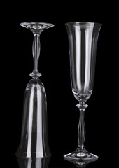 empty glasses for champagne isolated on black