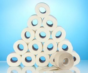 rolls of toilet paper on blue background