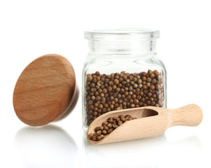 Jar of coriander seeds isolated on white