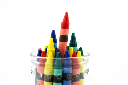 Assorted Colors Of Crayons In A Clear Jar