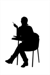 A silhouette of a young female sitting on a school chair