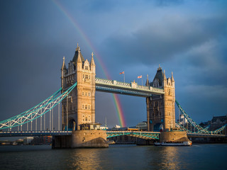 Fototapeta na wymiar Tower Bridge at sunset with rainbow after storm