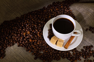 Coffee beans and white cup
