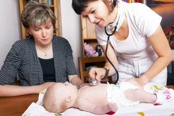 Doctor examines baby