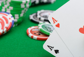 Gaming chips and cards on the green cloth