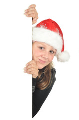 Teenage girl with Christmas hat looks around corner (isolated)