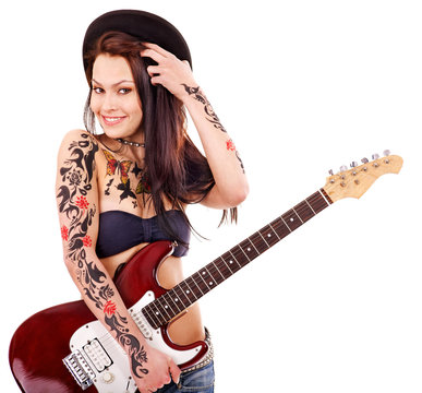 Girl with tattoo playing guitar.