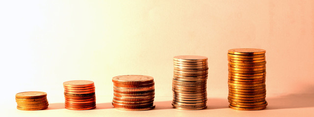 Coins stacks in tungsten light