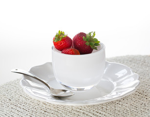 Breakfast of strawberries in glass dish