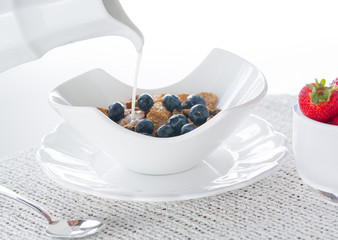 Breakfast of bran flakes blueberries