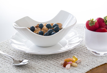 Breakfast of bran flakes blueberries