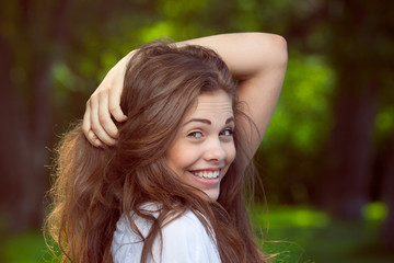 Naklejka premium Portrait of a beautiful young smiling girl