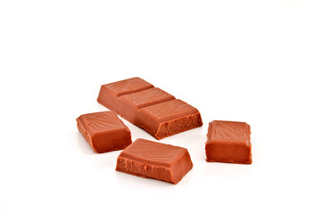 Broken chocolate bar on a white background