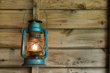 Rusty lantern hanging in a shed © lucielang
