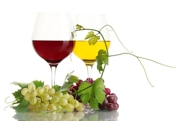 glasses of wine and ripe grapes with leaves isolated on white