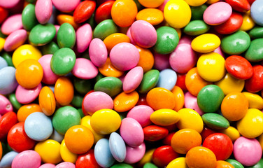 Fototapeta na wymiar Background image of sweet candies or chocolate buttons