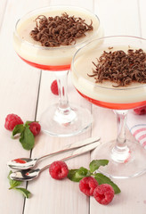 fruit jelly with berries in glasses on wooden table