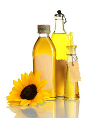 oil in jars and sunflower, isolated on white