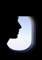 Silhouette of a Passenger in the Airplane