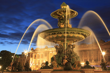 Fountain on Place de la Concorde in Paris at dusk , France