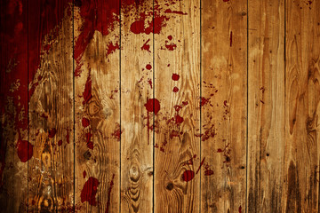 red paint splash on wood plank