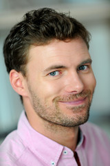 Obraz premium Portrait of handsome young smiling man