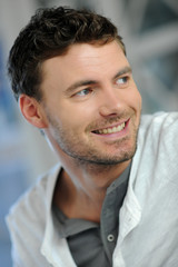 Obraz premium Portrait of handsome young smiling man