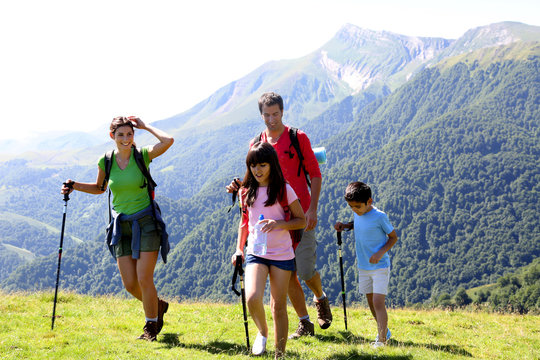 Family On A Trekking Day In The Mountains