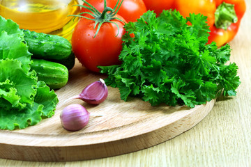 Fresh vegetables for the salad on a cutting board