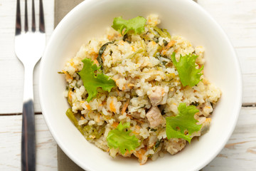 Fototapeta na wymiar Rice with pork, carrots and spinach