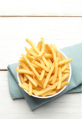 bowl of french fries on a turquoise napkin