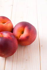 Peaches on wood table